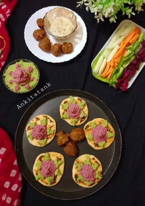 A picture of Mini Pita Bread With Colourful Hummus.