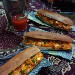 A picture of Cheesy paneer tikka hot dog.