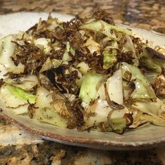 A picture of Sautéed cabbage with young sardine.