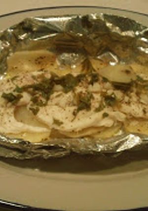 Una foto de Pescado empapelado con papas