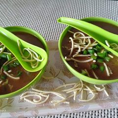 A picture of Vegetables manchau soup with homemade fried noodles.