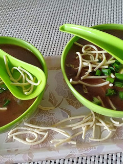 A picture of Vegetables manchau soup with homemade fried noodles.