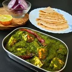 A picture of Palak Paneer or Indiana cottage cheese in Spinach gravy.