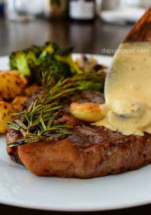 A picture of Rib Eye Steak with Mushroom Gravy Sauce (with local wisdom sauce).