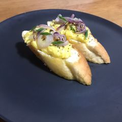 Egg Bruschetta With Cream Cheese And Saute Red Onions A picture of Egg Bruschetta With Cream Cheese And Saute Red Onions.