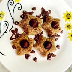 A picture of Gingercinnamon cookies on stove.