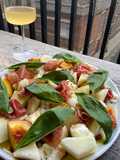 Simple melon, nectarine, mozzarella, Parma ham and basil salad