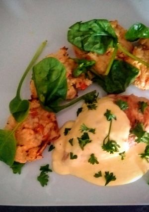 A picture of Celeriac veggie burgers & chicken with cheese sauce.