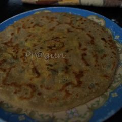A picture of Aloo/ Paneer Paratha.