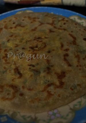 A picture of Aloo/ Paneer Paratha.