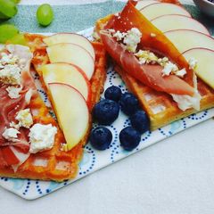 A picture of Breakfast waffles topped with prosciutto, apples, feta cheese & maple syrup.