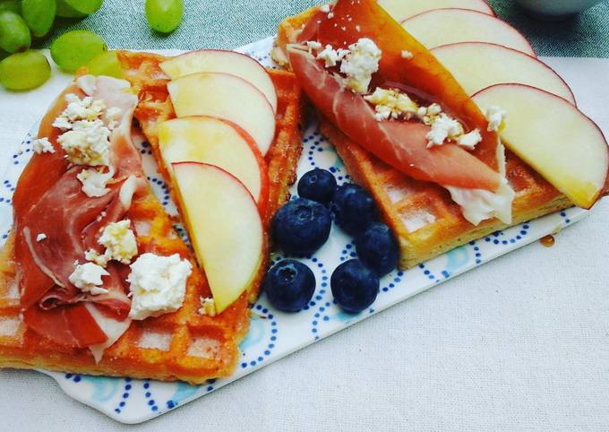 Breakfast waffles topped with prosciutto, apples, feta cheese & maple syrup