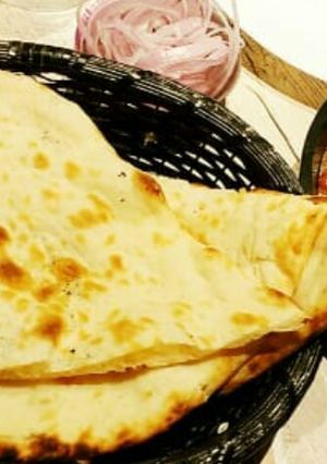 A picture of Naan with masala paneer.