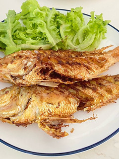 A picture of Deep Fried Golden Threadfin Bream With Fresh Turmeric.