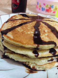 A picture of Fluffy pancakes 🥞 with chocolate glazing.