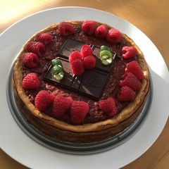 A picture of Dark Chocolate Coconut Raspberry Cheesecake.