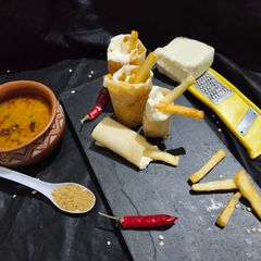 A picture of Paneer fries cheese loaded dosa.