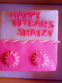 A picture of Decorating a cake with 2 colour fondant.