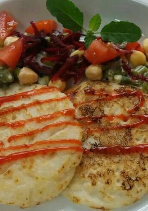 A picture of Dosa with Tomato chickpea salsa.