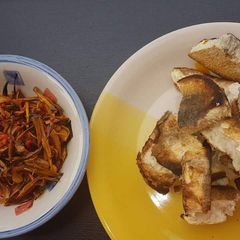 A picture of Roasted yam with palmoil and ugba.