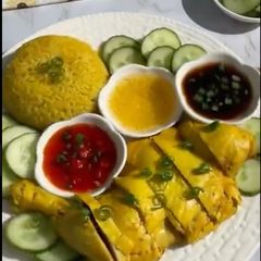 Hainanese Chicken with Yellow Rice A picture of Hainanese Chicken with Yellow Rice.
