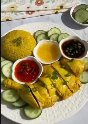 A picture of Hainanese Chicken with Yellow Rice.