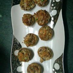 A picture of Baked stuffed mushroom in airfryer.