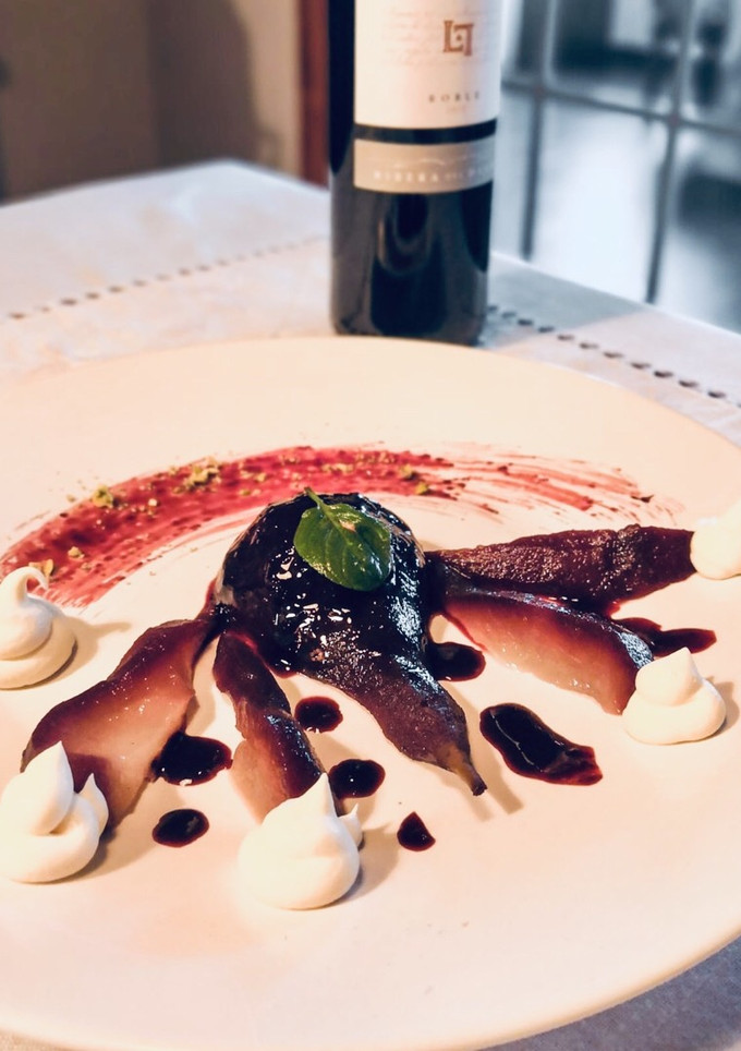 Una foto de Peras al vino