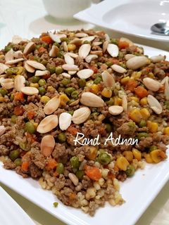 صورة لوصفة أوزي بالبرغل و اللحمة المفرومه 🥕🌽🍃