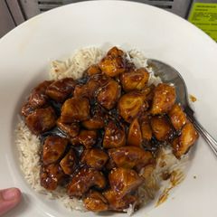 A picture of Garlic honey chicken and rice.