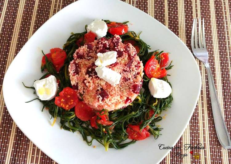 Cous cous con rapa rossa, agretti, pomodori e caprino