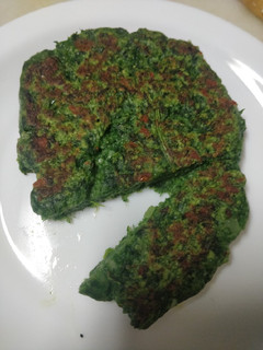 Una foto de Hamburguesa de espinacas y cebolla