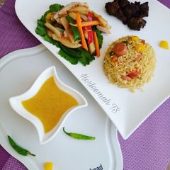 A picture of Teriyaki rice, chicken salad with honey and orange dressing.