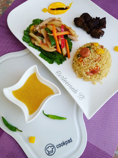 A picture of Teriyaki rice, chicken salad with honey and orange dressing.