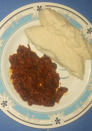A picture of Ugali with fried fish curry.