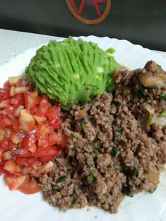 A picture of Mukimo, minced meat n kachumbari.