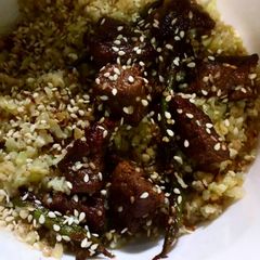 A picture of Soy garlic chicken with caulirice.