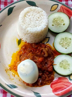 A picture of Cucumber Egg Gravy and Scooped Rice.