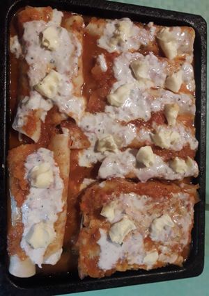 Una foto de Canelones de masa rellenos de pollo