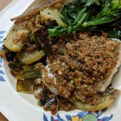 A picture of Baked hake with Parmesan crumb, potatoes + leeks.