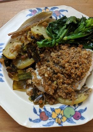 A picture of Baked hake with Parmesan crumb, potatoes + leeks.