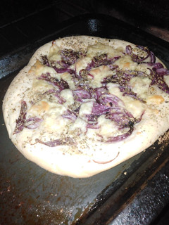 Una foto de Fugazza o pizza genovesa