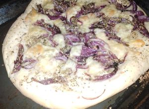 Una foto de Fugazza o pizza genovesa