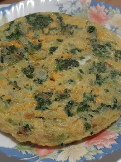 Una foto de Tortilla de espinacas y maíz