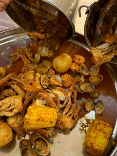 A picture of Seafood boil w/red n hot sauce.