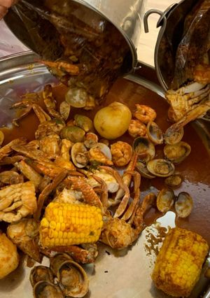 A picture of Seafood boil w/red n hot sauce.