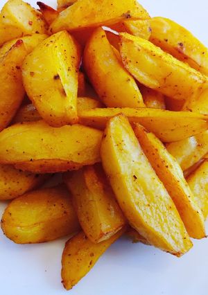 A picture of Baked turmeric potato wedges.