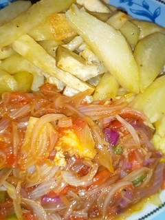 A picture of Fried sweet potatoes with onion sauce.