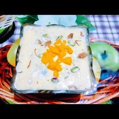 A picture of Rabdi with mango and dry fruits.