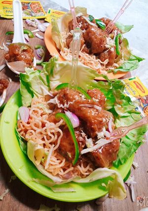 A picture of Garlic Maggi noodles and dry potato manchurian.
